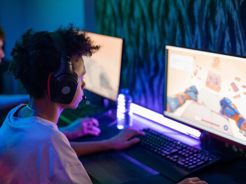 A young gamer focusing intensely on a screen, representing visual focus and strain during gaming.