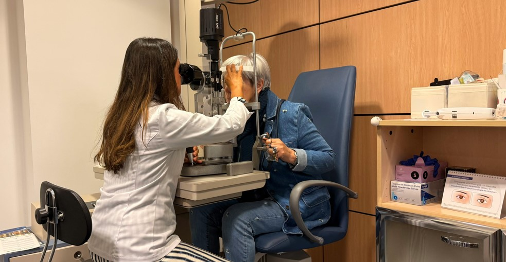 Ophthalmologist examining a senior woman’s eyes during a routine checkup