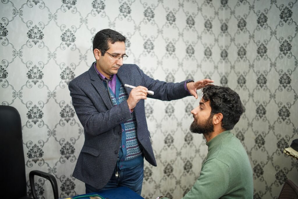 Ophthalmologist evaluating patient for modern Thyroid Eye Disease Treatment and orbital decompression