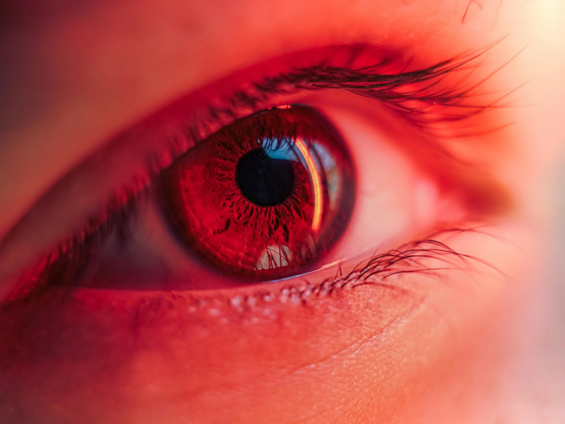 Close-up visual of a safe, low-level Red Light Therapy for Eyes session