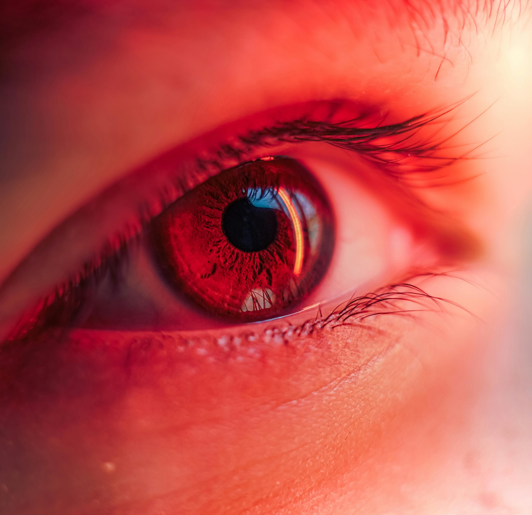 Close-up visual of a safe, low-level Red Light Therapy for Eyes session