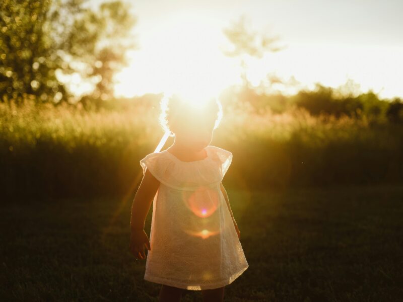 Outdoor Light Eye Health starts with sunlight: A person standing in bright natural light, representing the beneficial Dopamine release for vision.