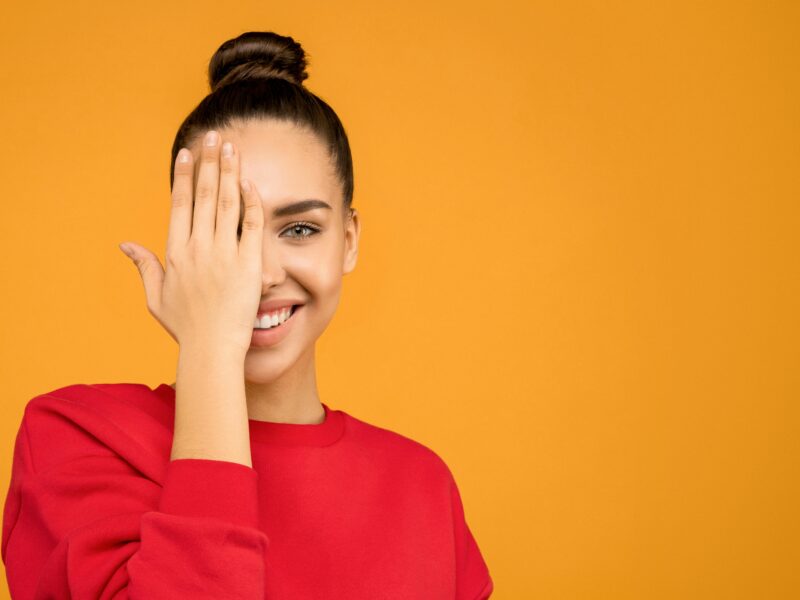 Person performing a focus exercise, illustrating active Ocular Fitness and visual training.