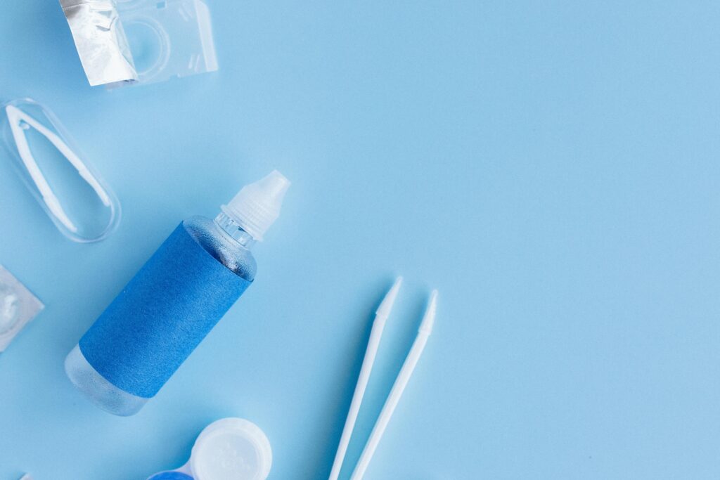 Eye drops and sunglasses used for Uveitis treatment and light sensitivity relief.