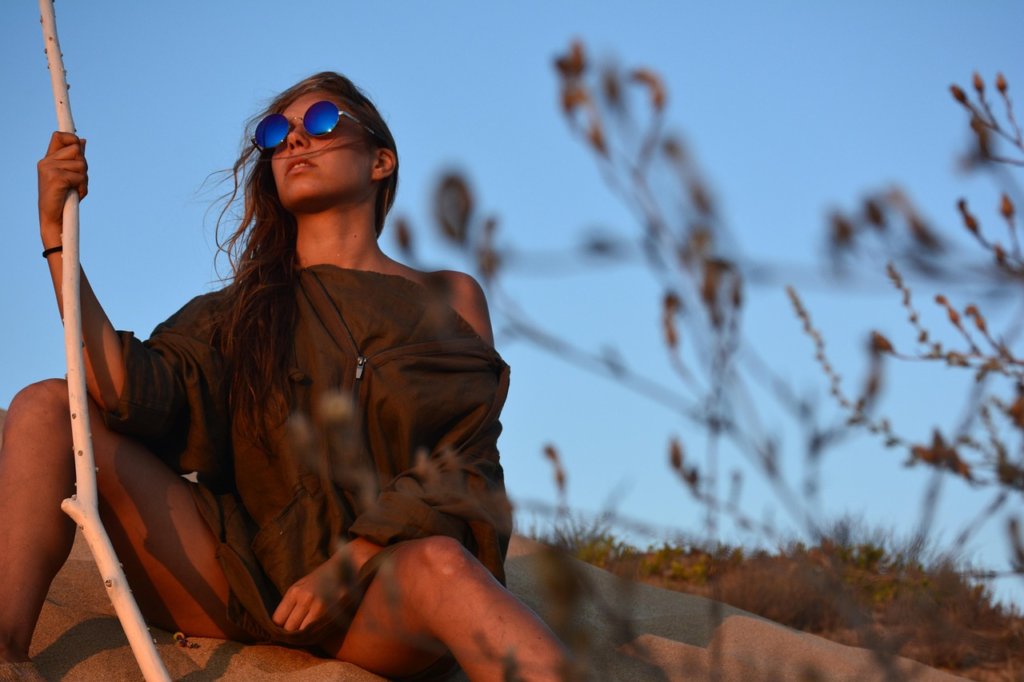 Stylish UV protection for eyes using professional sunglasses during peak sun hours at sunset