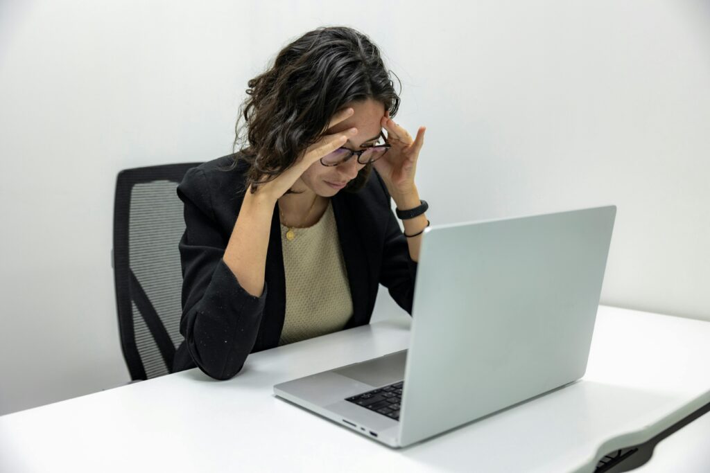 office worker experiencing digital eye strain causing blurry vision