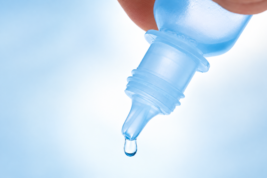 applying eye drops to relieve eye pain without redness and dry eye