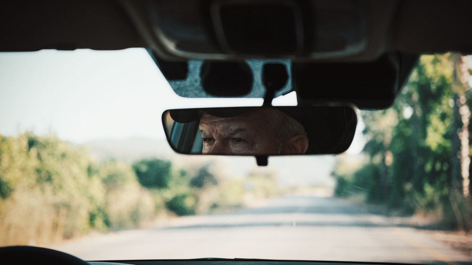 Focused driver looking at the highway demonstrating Eye Strain From Driving during long road trips