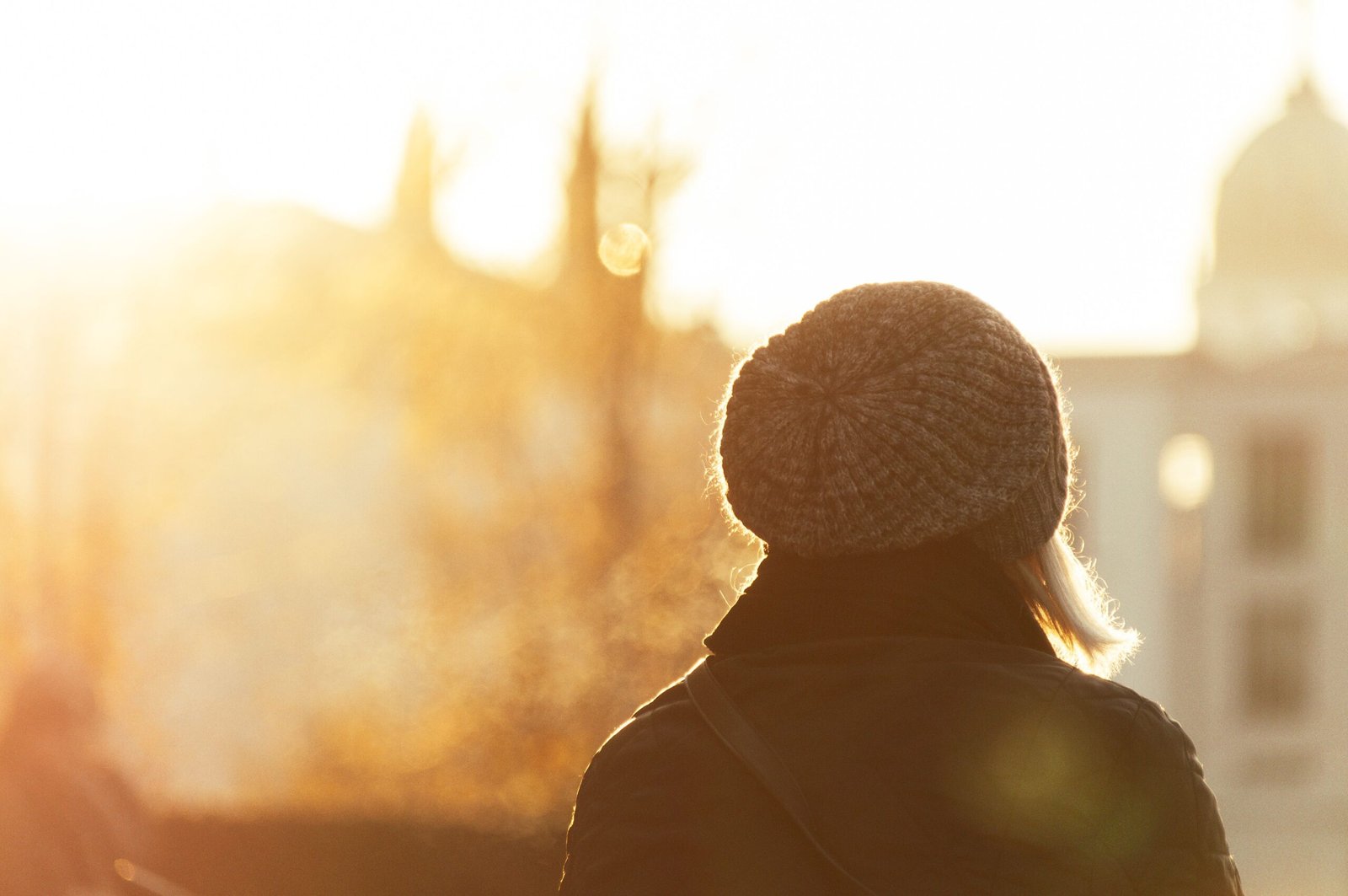 A person standing in bright natural light representing dopamine release for Outdoor Light Eye Health